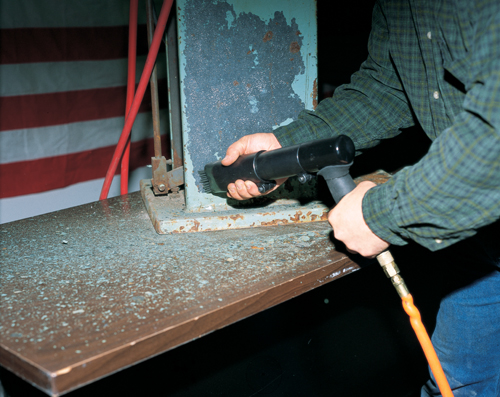 Needle Scaler in an industrial setting